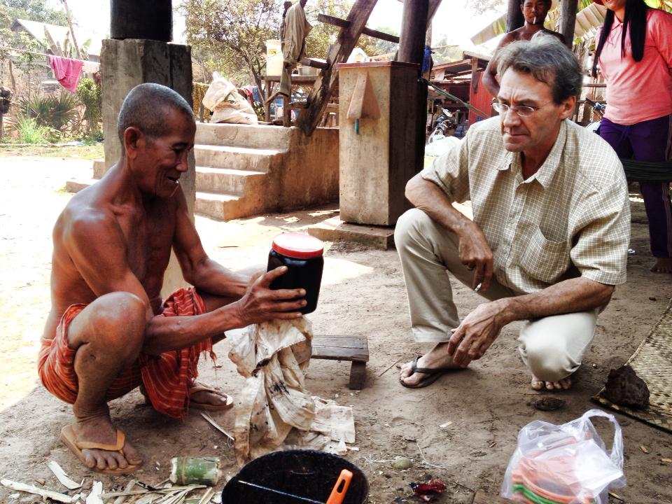 PRODUCTIVITY: Ta Ly and Eric Stocker with a collection of sap which Mr Stocker helped filter.