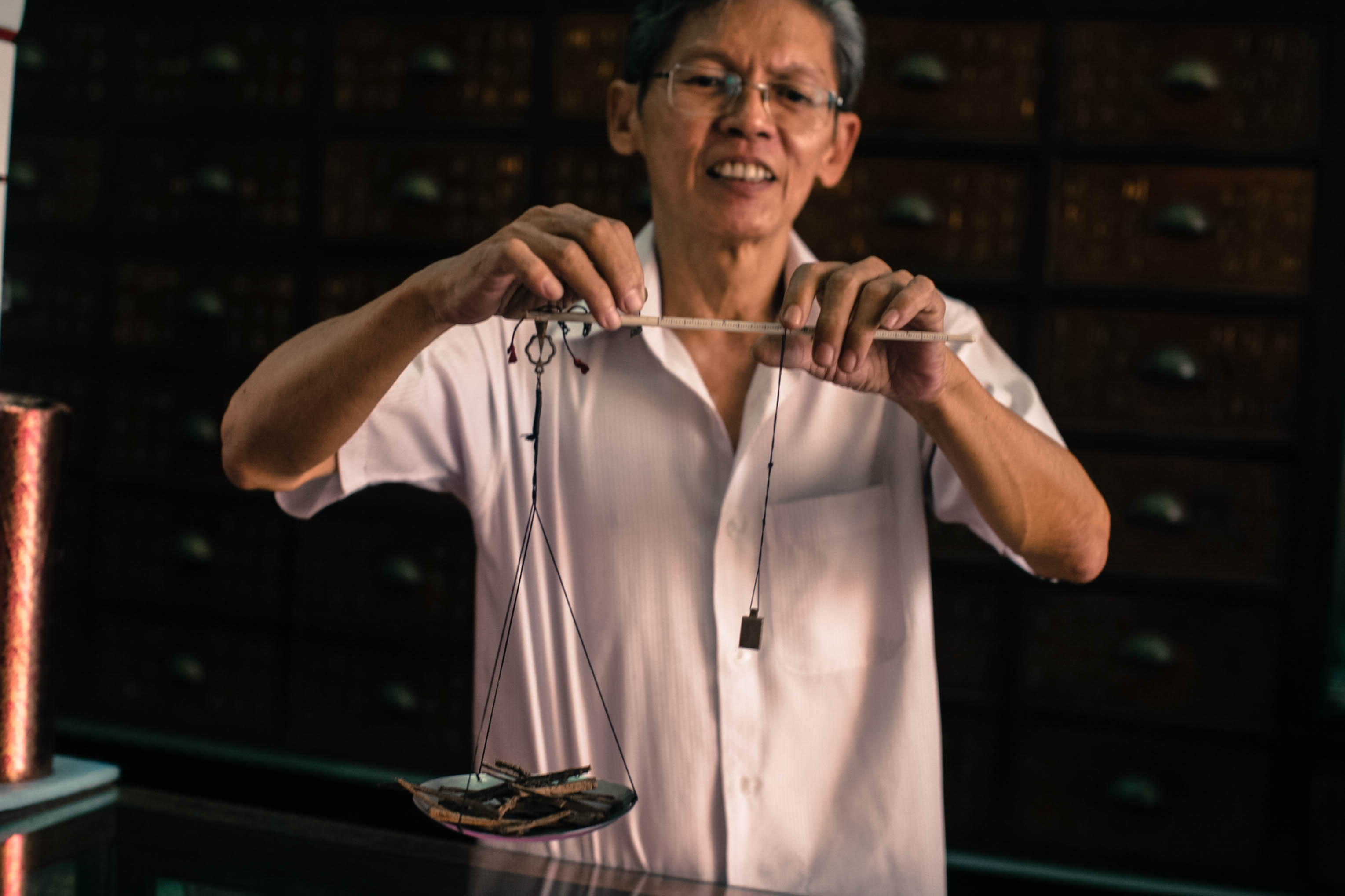 TOOLS: A traditional Chinese weighing scale Mr.Kok uses. He has an electronic one too. 