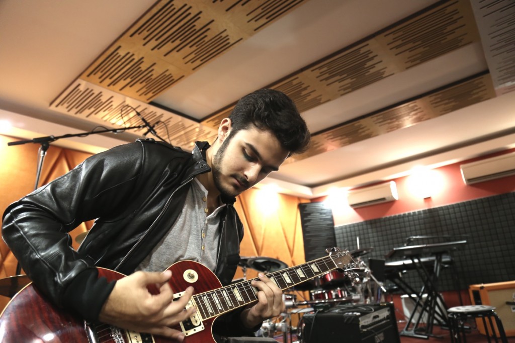 Above: Leonard ‘Leo’ Zaccaria playing a tune on the electric guitar. Photo: Contented